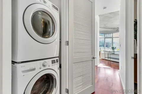 a view of a hallway with washer and dryer
