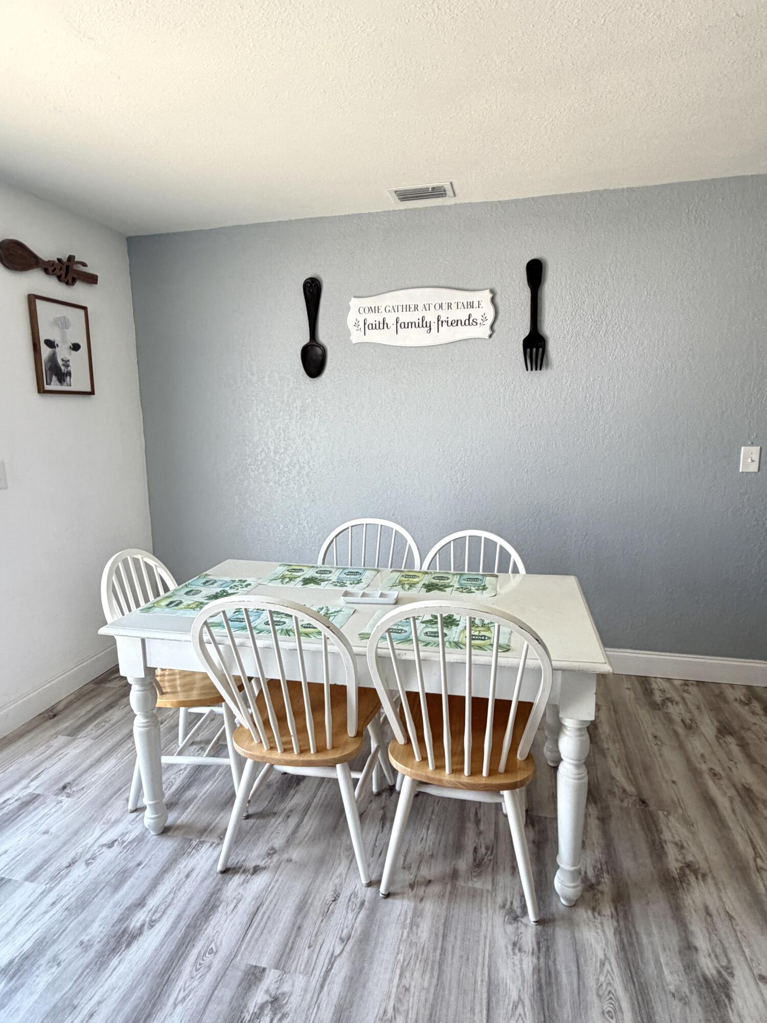 180 Southwest 21st Avenue Okeechobee, FL 34974 - Photo 13 of 21 a view of a dining room with furniture and wooden floor