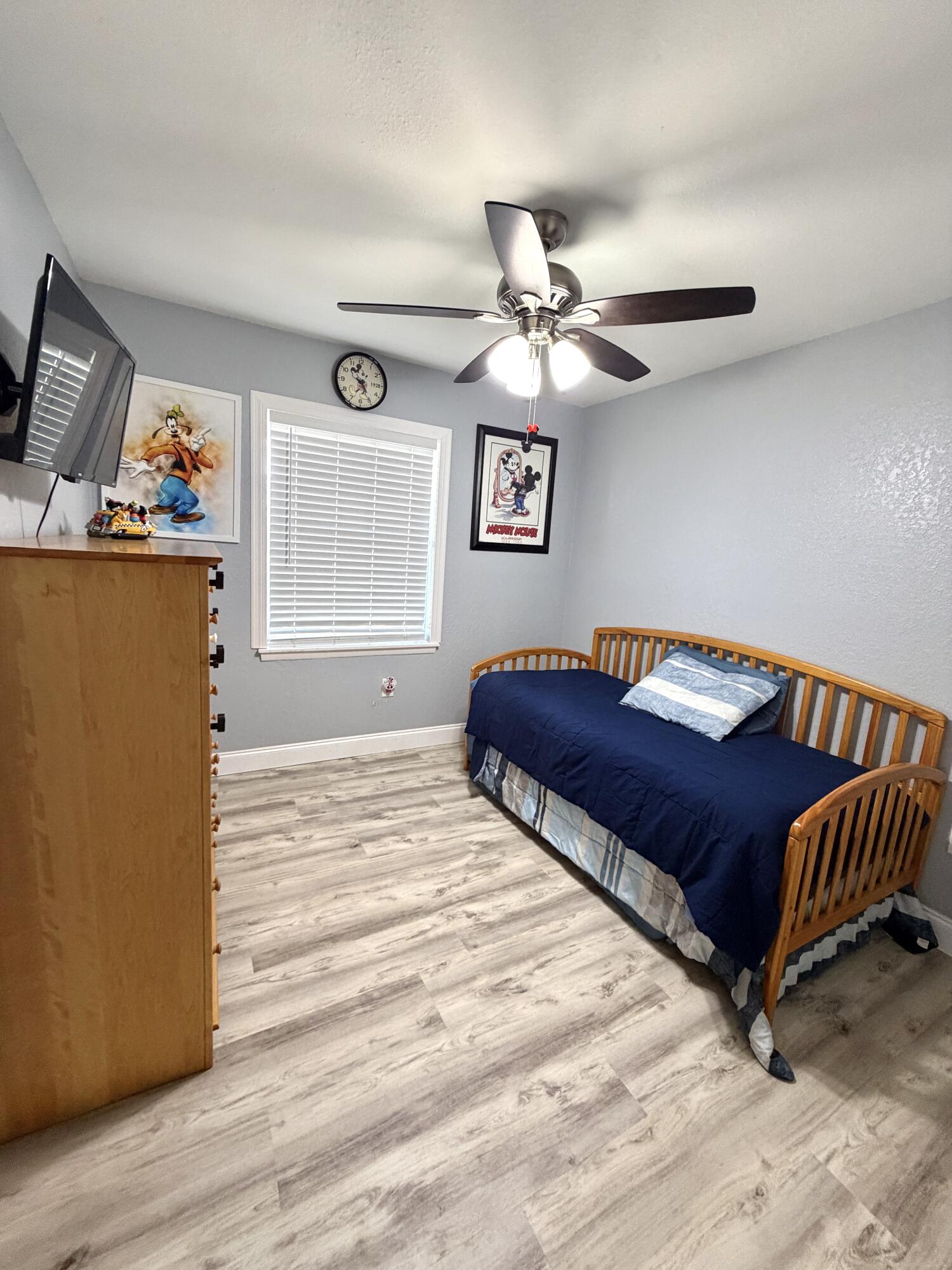 180 Southwest 21st Avenue Okeechobee, FL 34974 - Photo 17 of 21 a bedroom with a bed and wooden floor