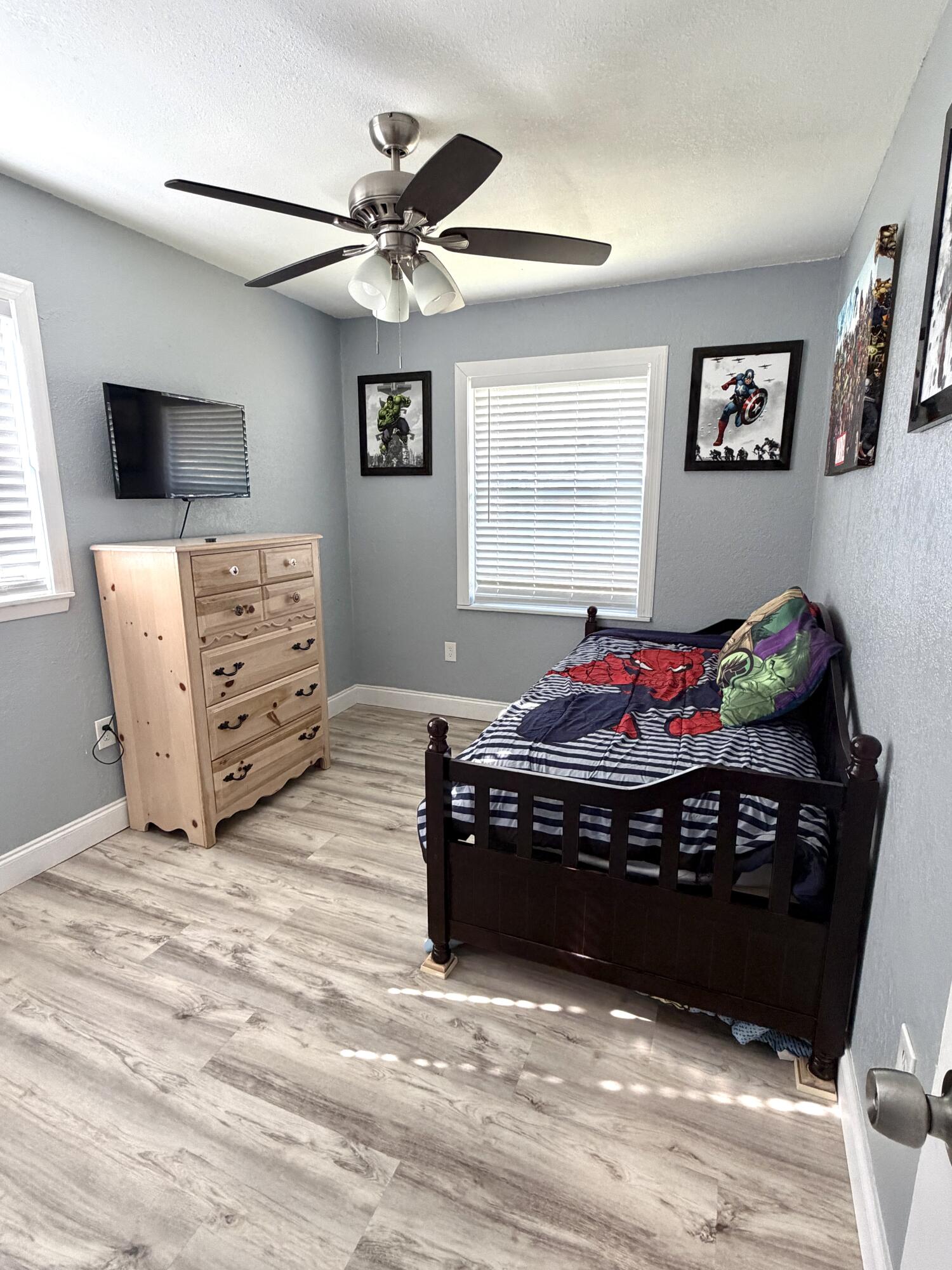 180 Southwest 21st Avenue Okeechobee, FL 34974 - Photo 18 of 21 a bed room with a bed and a television