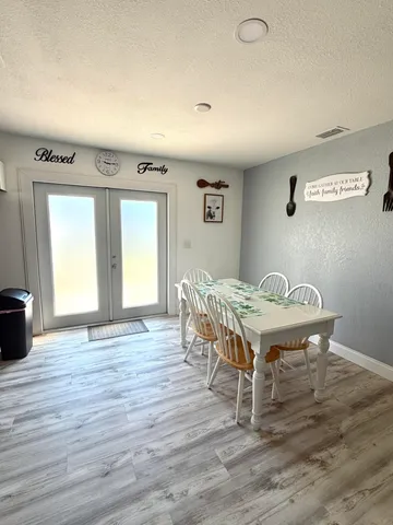 a room with a table and chairs