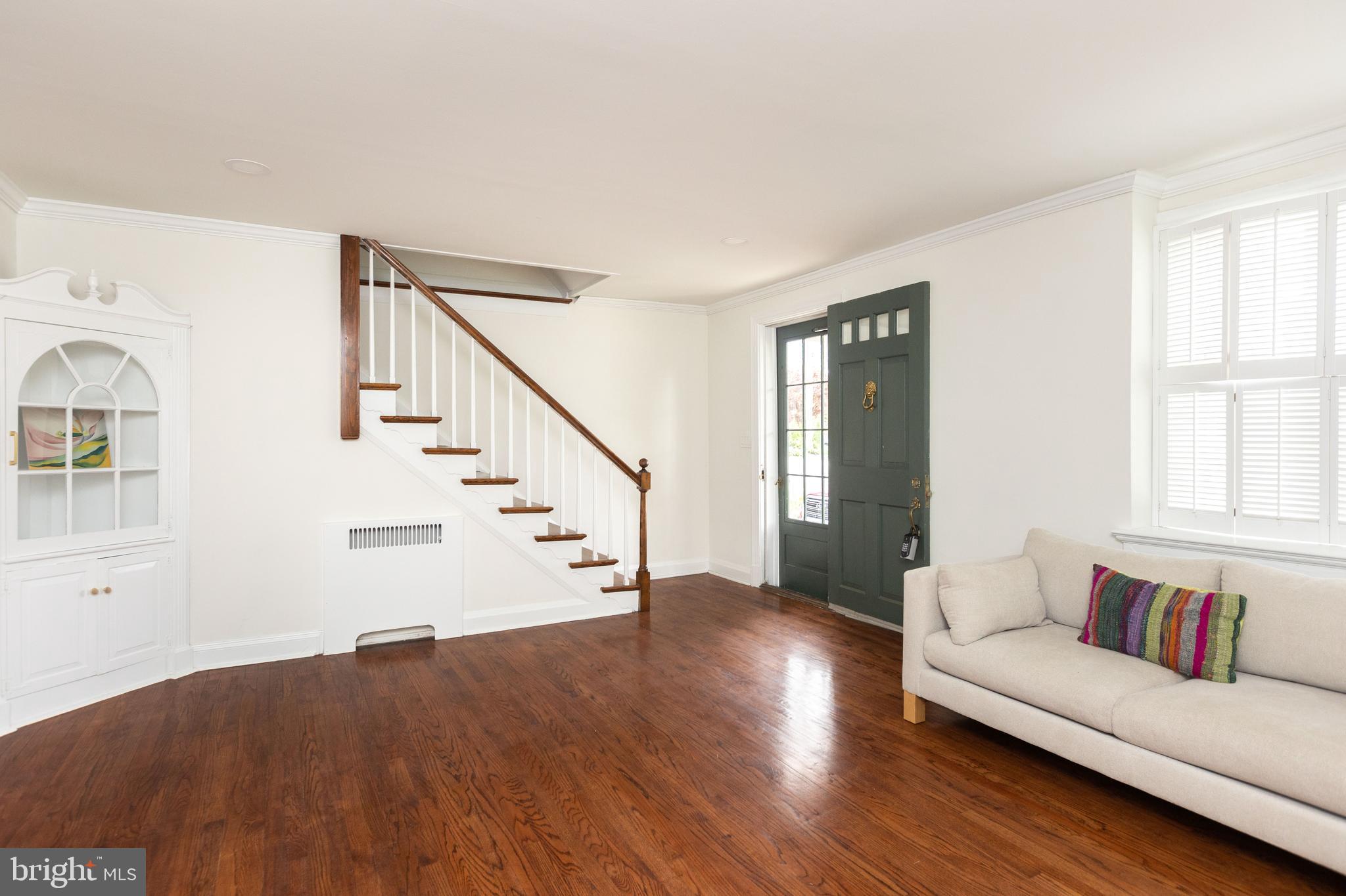 710 Regester Avenue Baltimore, MD 21212 - Photo 11 of 48 a living room with furniture and wooden floor
