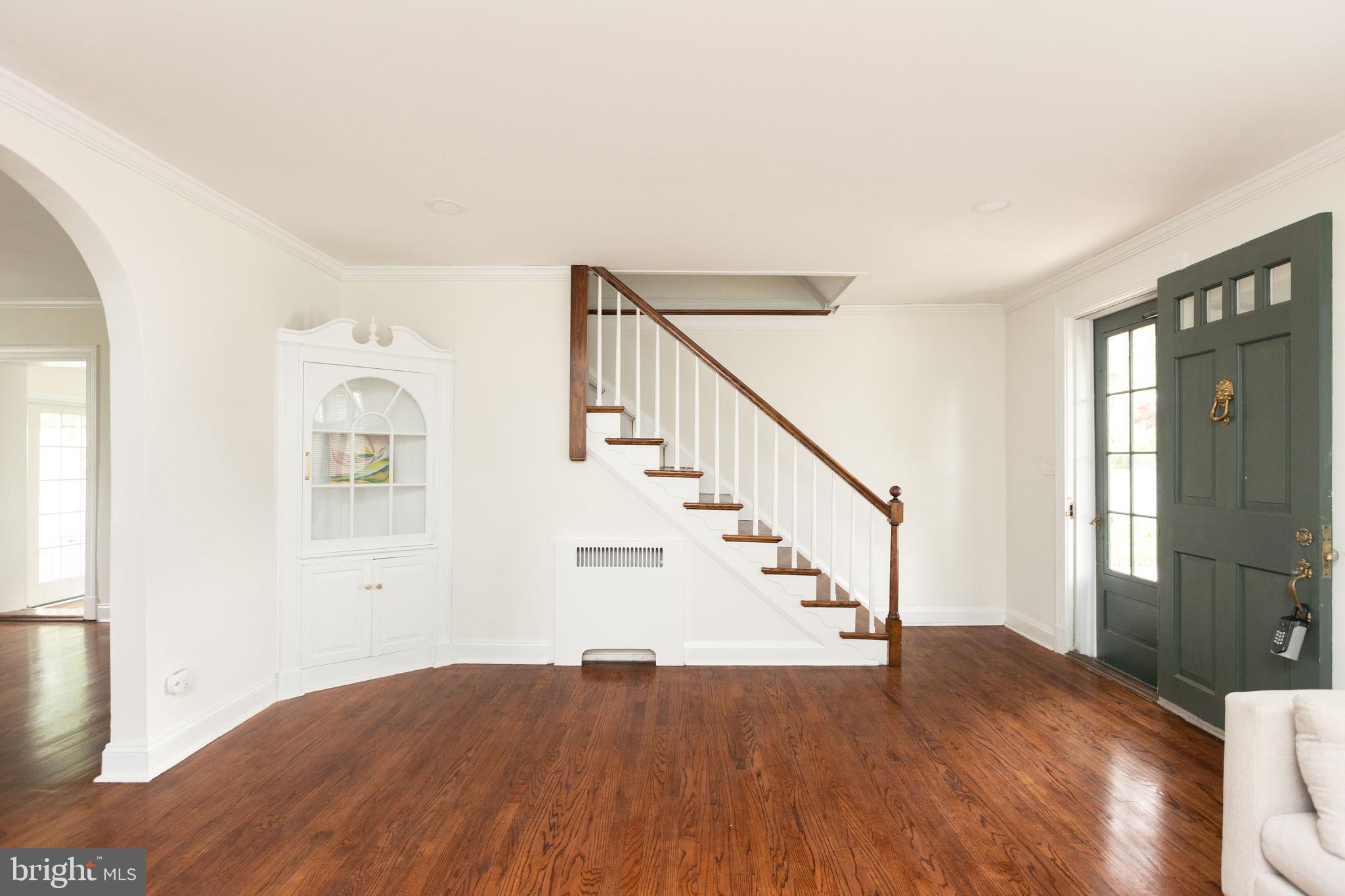 710 Regester Avenue Baltimore, MD 21212 - Photo 12 of 48 a view of entryway and hall with wooden floor