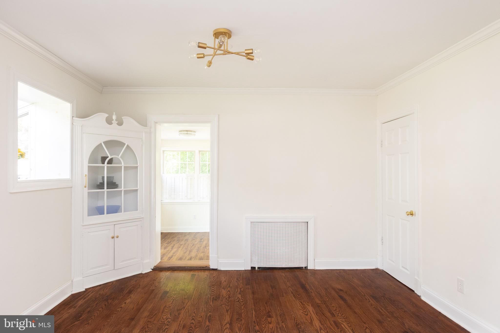 710 Regester Avenue Baltimore, MD 21212 - Photo 18 of 48 a view of empty room with wooden floor and fan