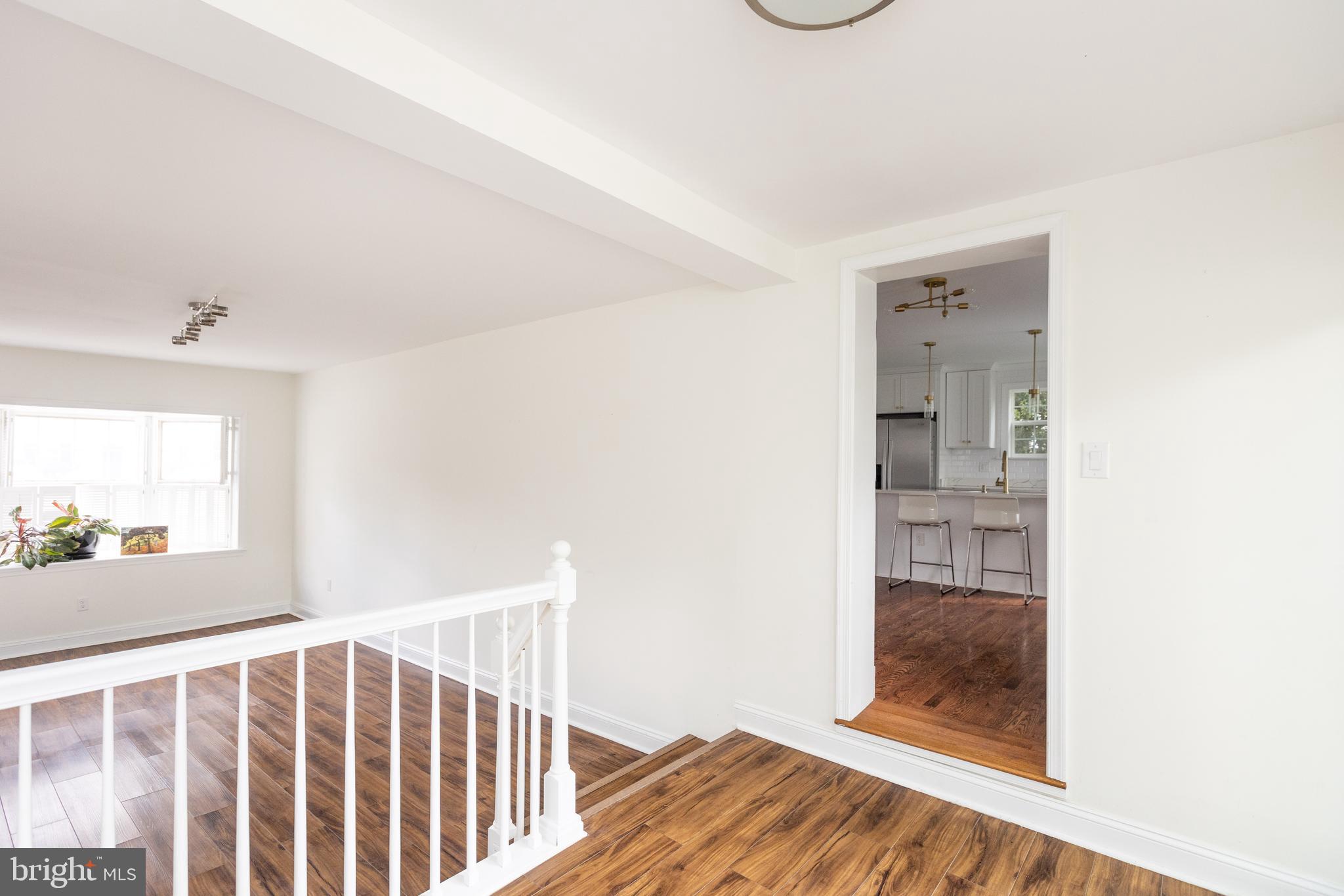 710 Regester Avenue Baltimore, MD 21212 - Photo 19 of 48 a view of hallway with wooden floor
