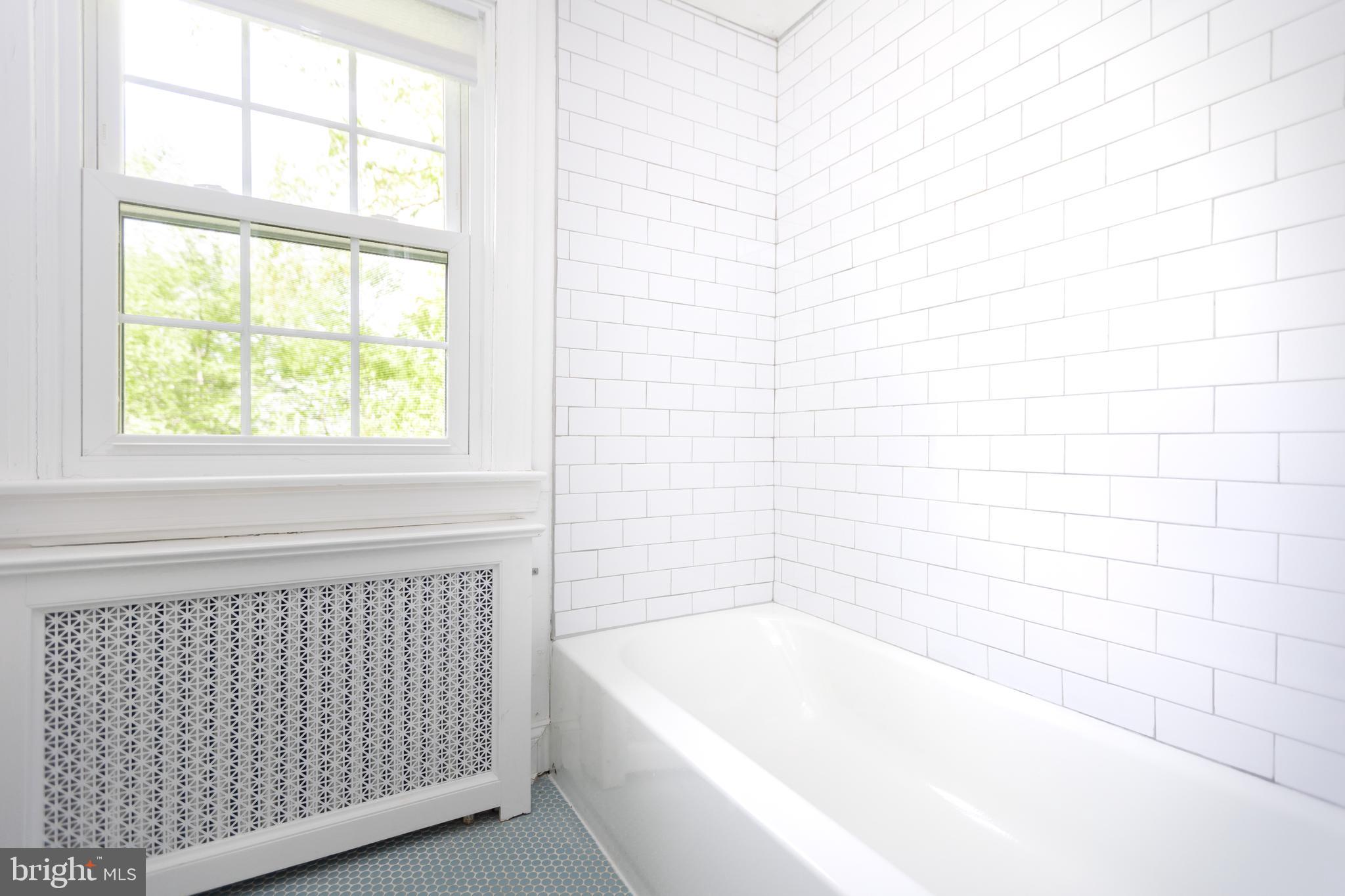 710 Regester Avenue Baltimore, MD 21212 - Photo 30 of 48 a bathroom with a bathtub