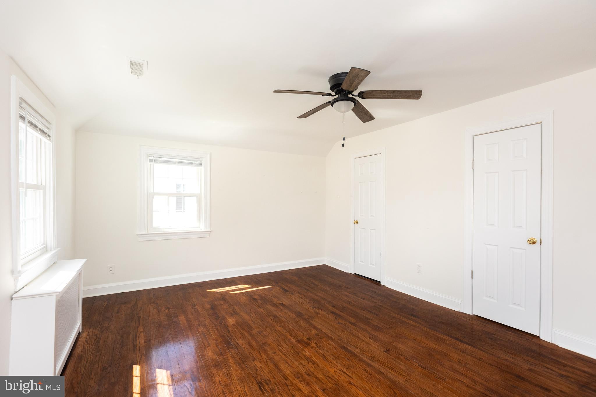710 Regester Avenue Baltimore, MD 21212 - Photo 32 of 48 a view of a room with wooden floor and fan