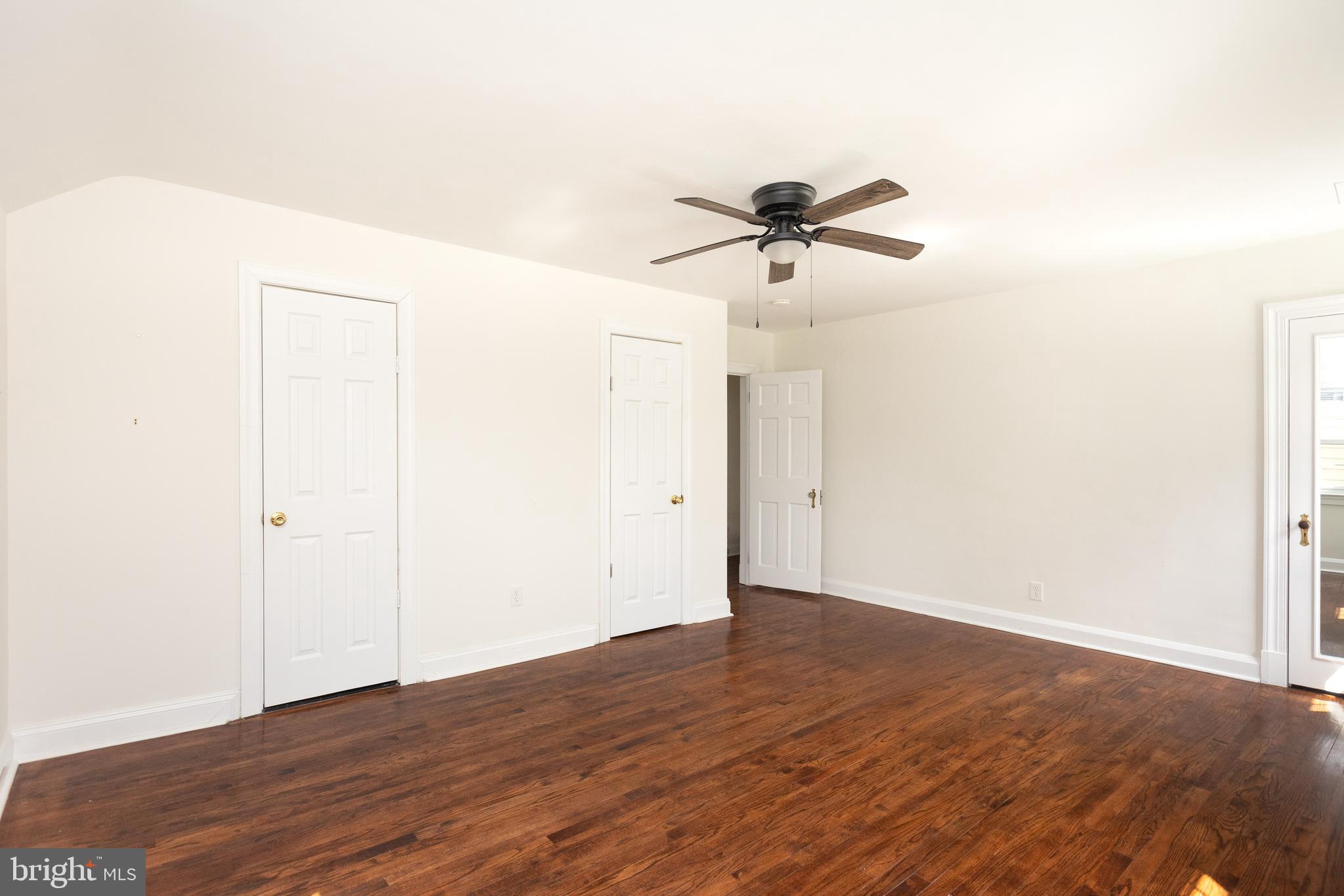 710 Regester Avenue Baltimore, MD 21212 - Photo 33 of 48 a view of an empty room with wooden floor