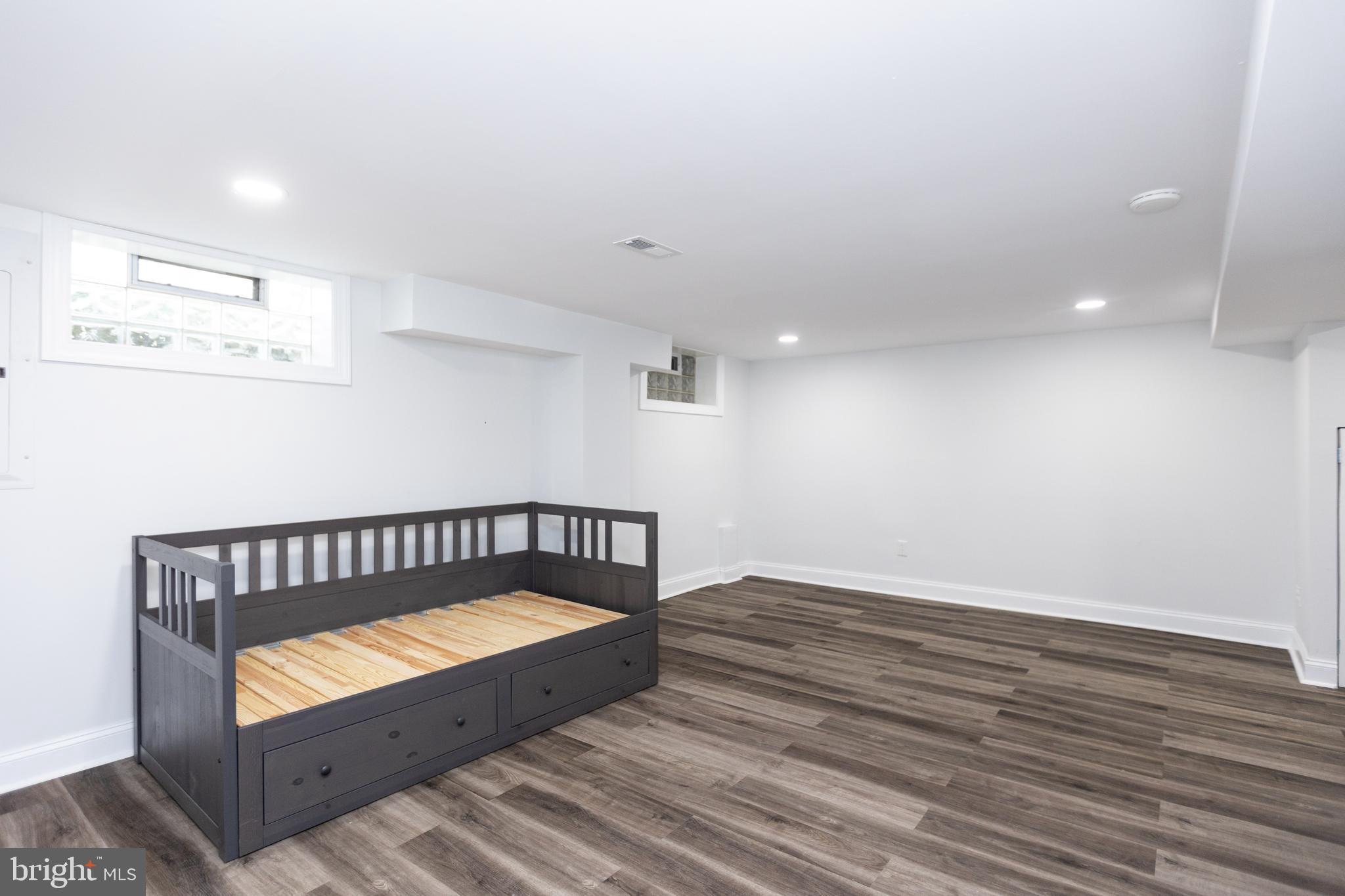 710 Regester Avenue Baltimore, MD 21212 - Photo 37 of 48 an empty room with wooden floor
