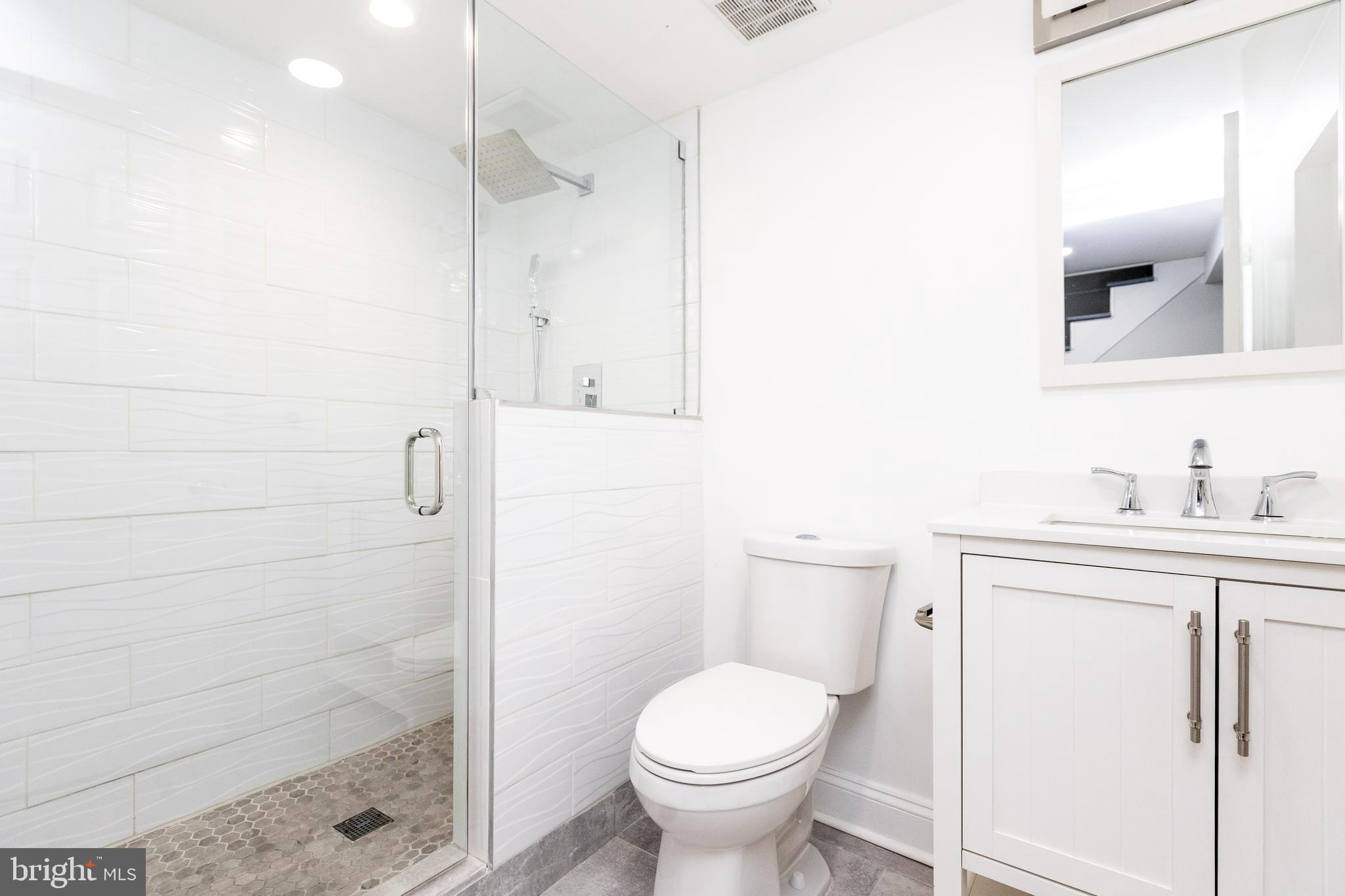 710 Regester Avenue Baltimore, MD 21212 - Photo 38 of 48 a bathroom with a sink a toilet and shower
