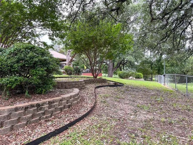 a view of backyard with green space