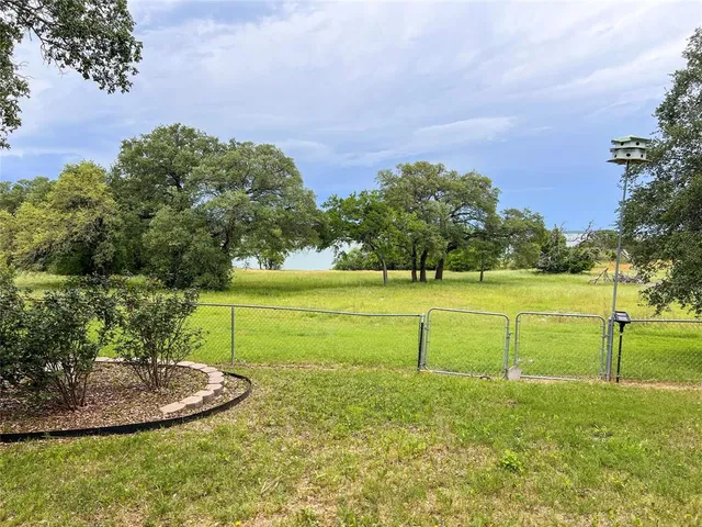 a view of a golf course with a lake view