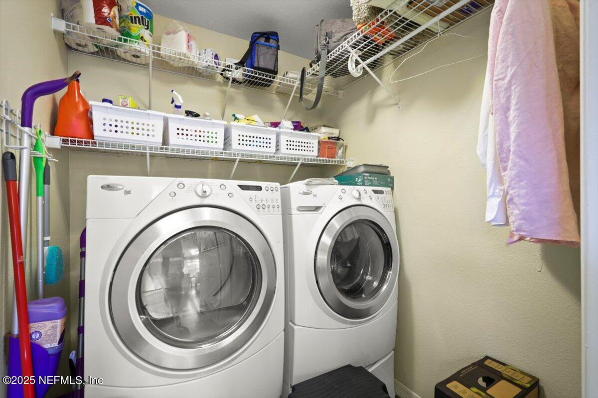 10961 Burnt Mill Road, Unit 1132 Jacksonville, FL 32256 - Photo 20 of 47 a utility room with dryer and washer