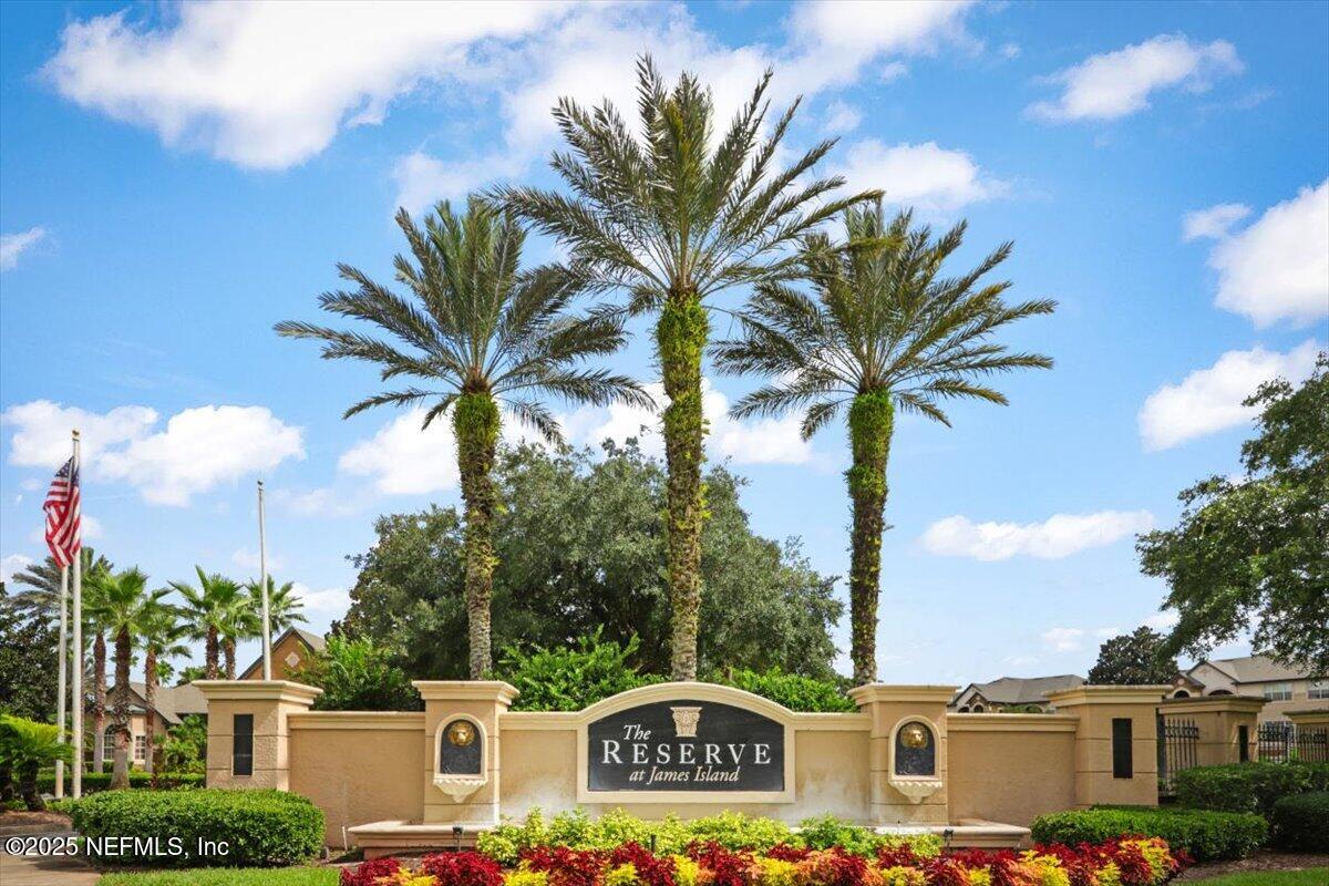 10961 Burnt Mill Road, Unit 1132 Jacksonville, FL 32256 - Photo 30 of 47 a front view of a multi story residential apartment building with a yard and entryway