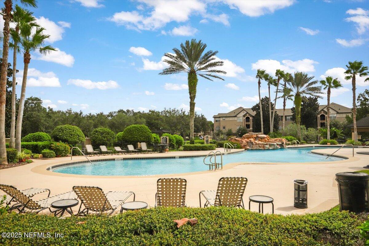 10961 Burnt Mill Road, Unit 1132 Jacksonville, FL 32256 - Photo 34 of 47 a view of a lake with couches and city view