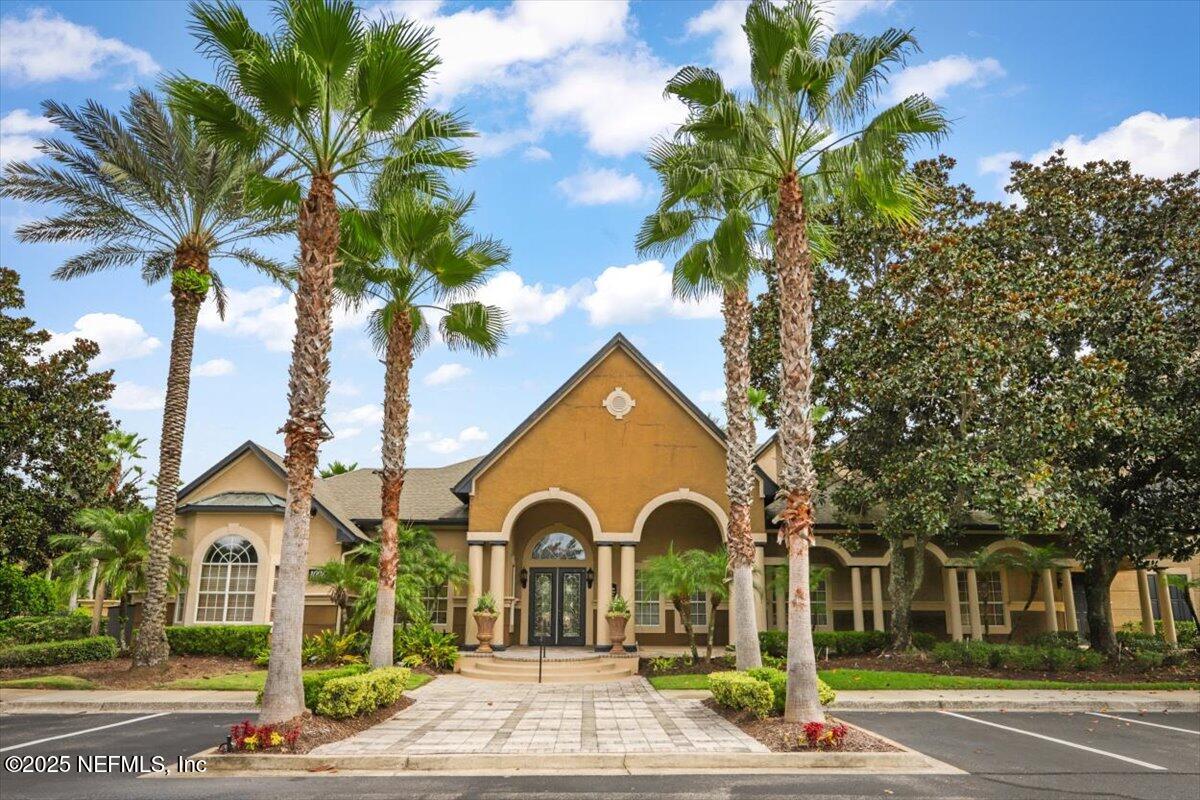 10961 Burnt Mill Road, Unit 1132 Jacksonville, FL 32256 - Photo 35 of 47 a front view of a house with a garden