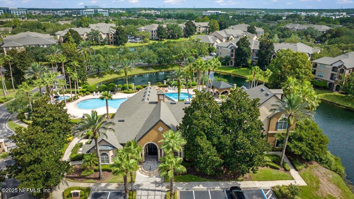 10961 Burnt Mill Road, Unit 1132 Jacksonville, FL 32256 - Photo 44 of 47 an aerial view of a house with a yard and lake view