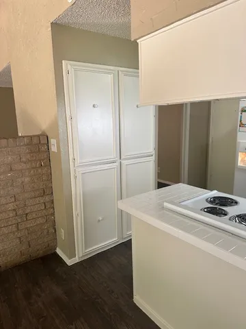 a kitchen with stainless steel appliances granite countertop a refrigerator and a stove