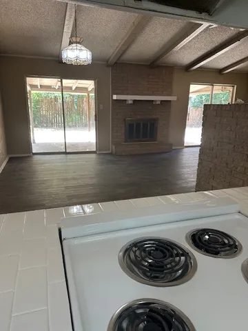 a kitchen with a stove and a microwave