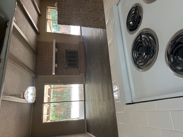 1001 Ridgeline Drive Round Rock, TX 78664 - Photo 6 of 11 a kitchen with a stove and a microwave