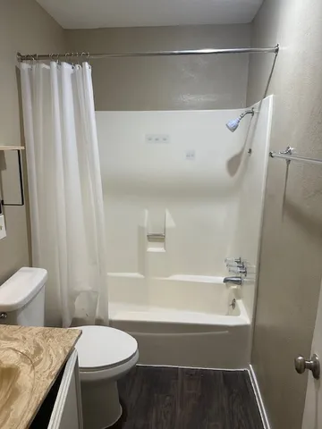 a view of a chandelier fan in a room