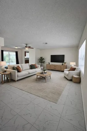 a living room with furniture and white couch