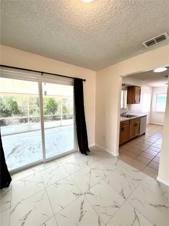 a view of an empty room and window