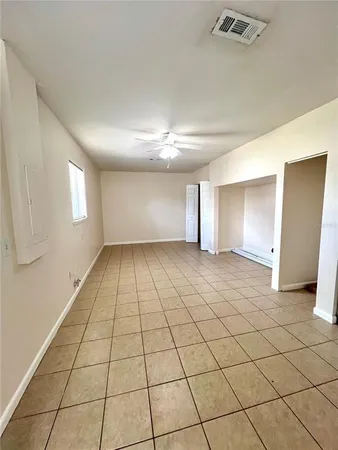 a view of an empty room and window