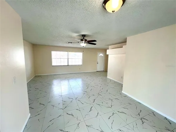 a view of an empty room and window