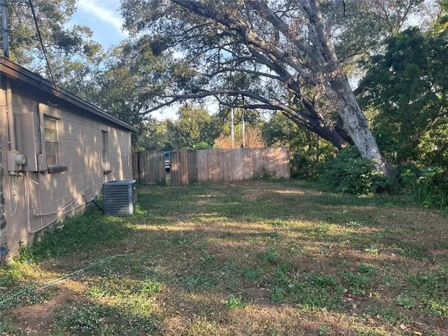 a backyard of a house with lots of green space