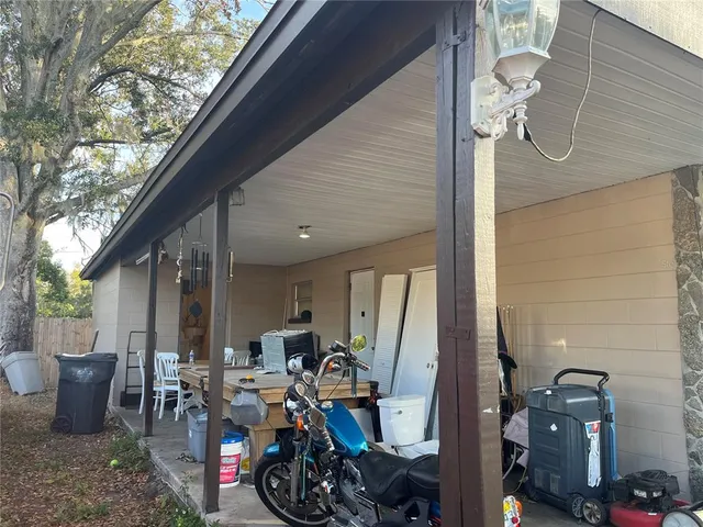 a front view of a house with outdoor seating