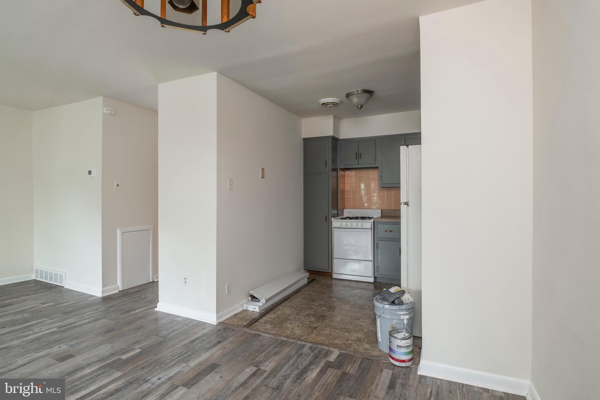 2730 Cranston Road Philadelphia, PA 19131 - Photo 11 of 25 a view of a hallway with wooden floor and a bathroom