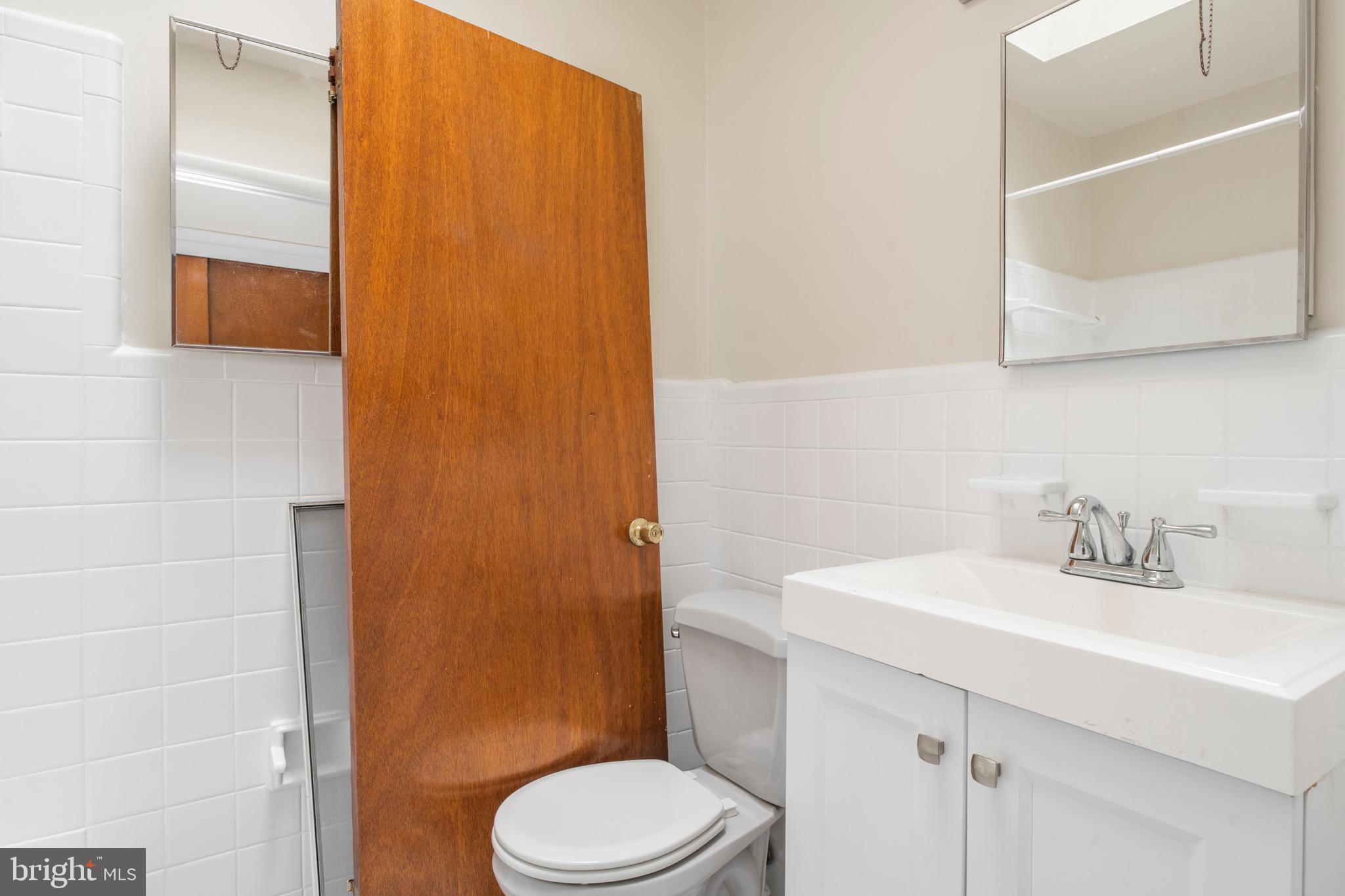 2730 Cranston Road Philadelphia, PA 19131 - Photo 15 of 25 a bathroom with a sink a toilet and shower