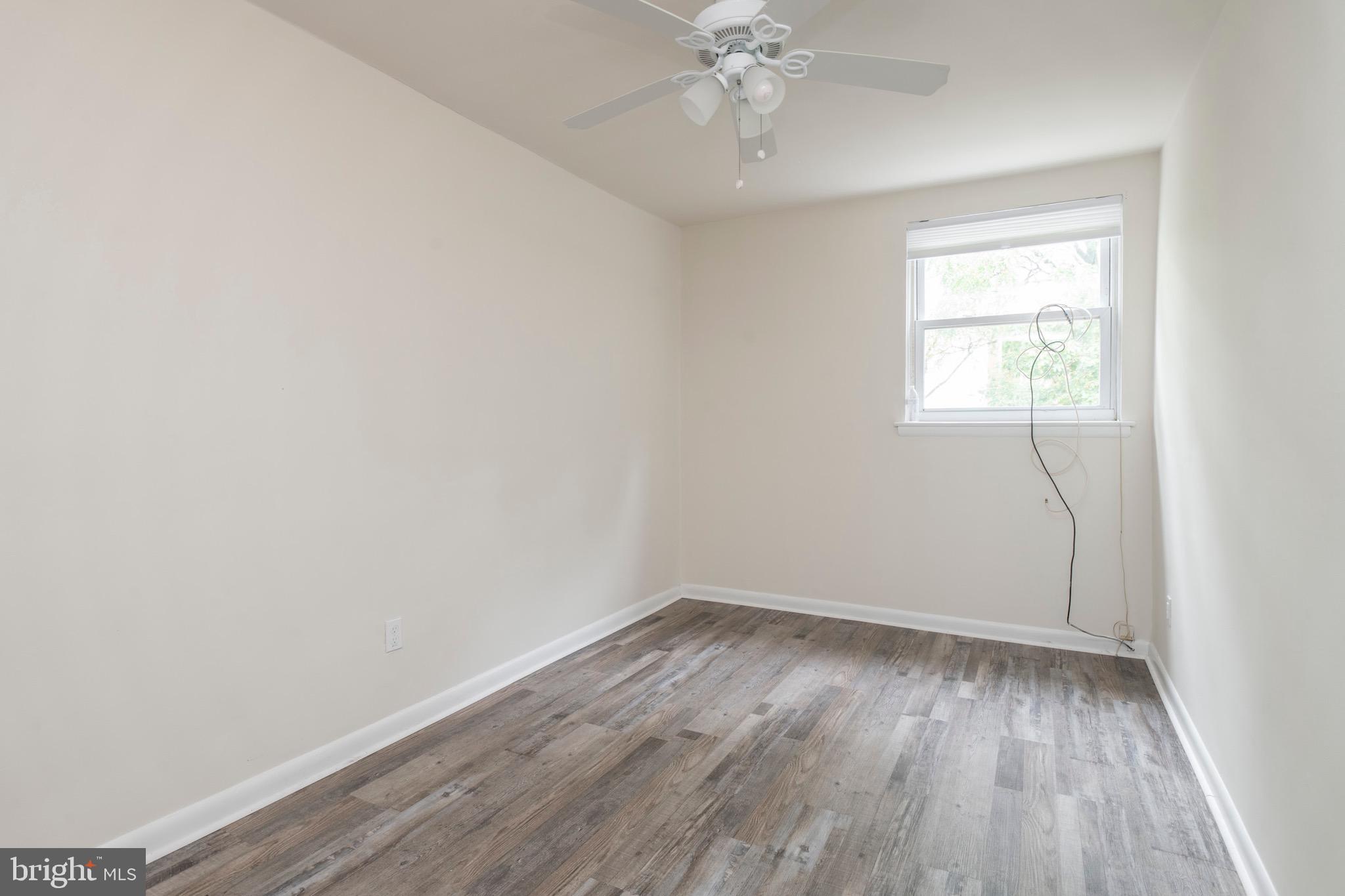 2730 Cranston Road Philadelphia, PA 19131 - Photo 16 of 25 wooden floor in an empty room with a window