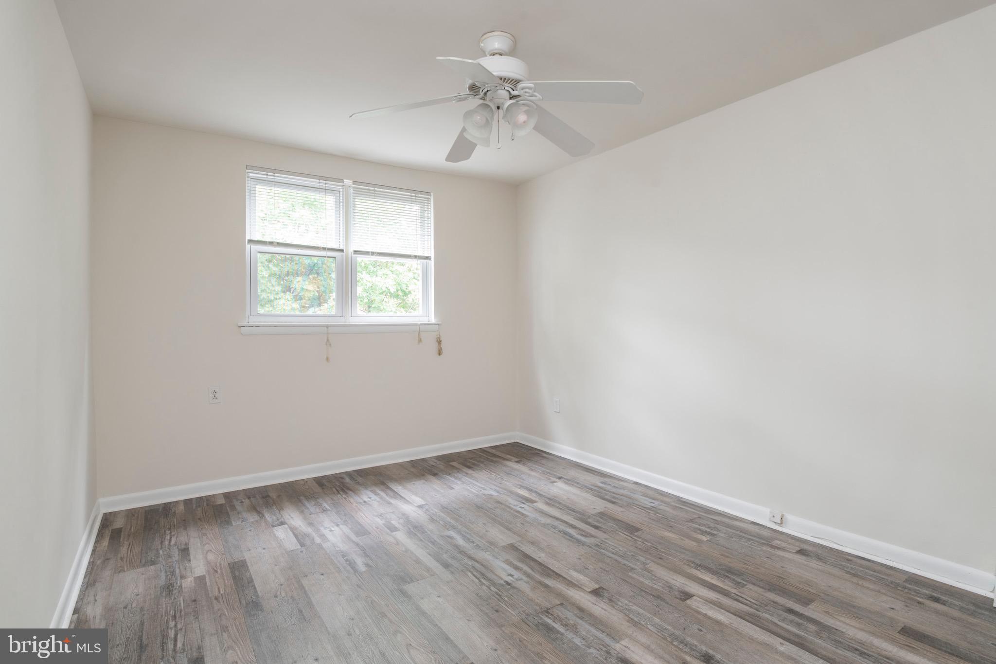 2730 Cranston Road Philadelphia, PA 19131 - Photo 19 of 25 wooden floor in an empty room with a window
