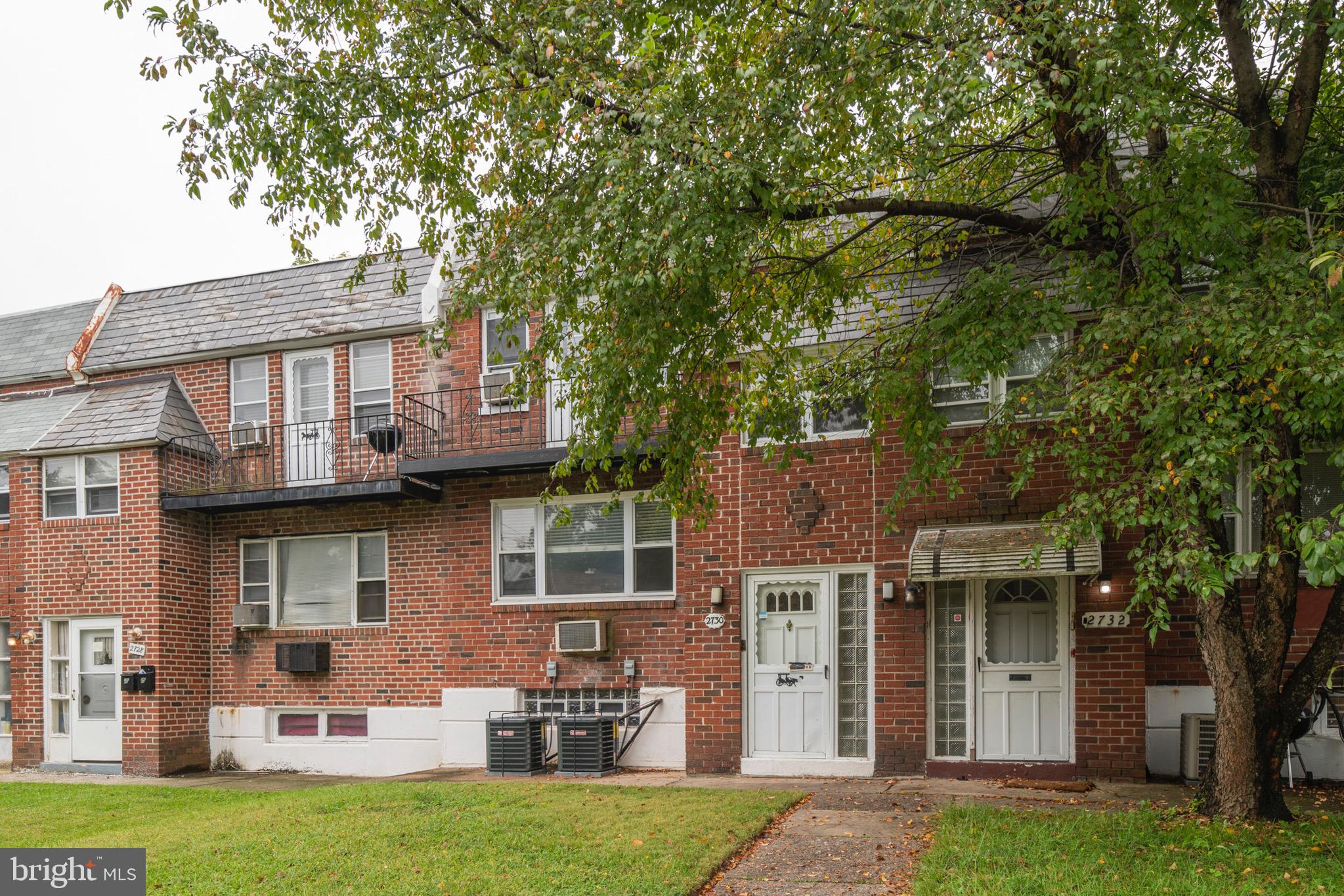2730 Cranston Road Philadelphia, PA 19131 - Photo 2 of 25 front view of a house with a yard