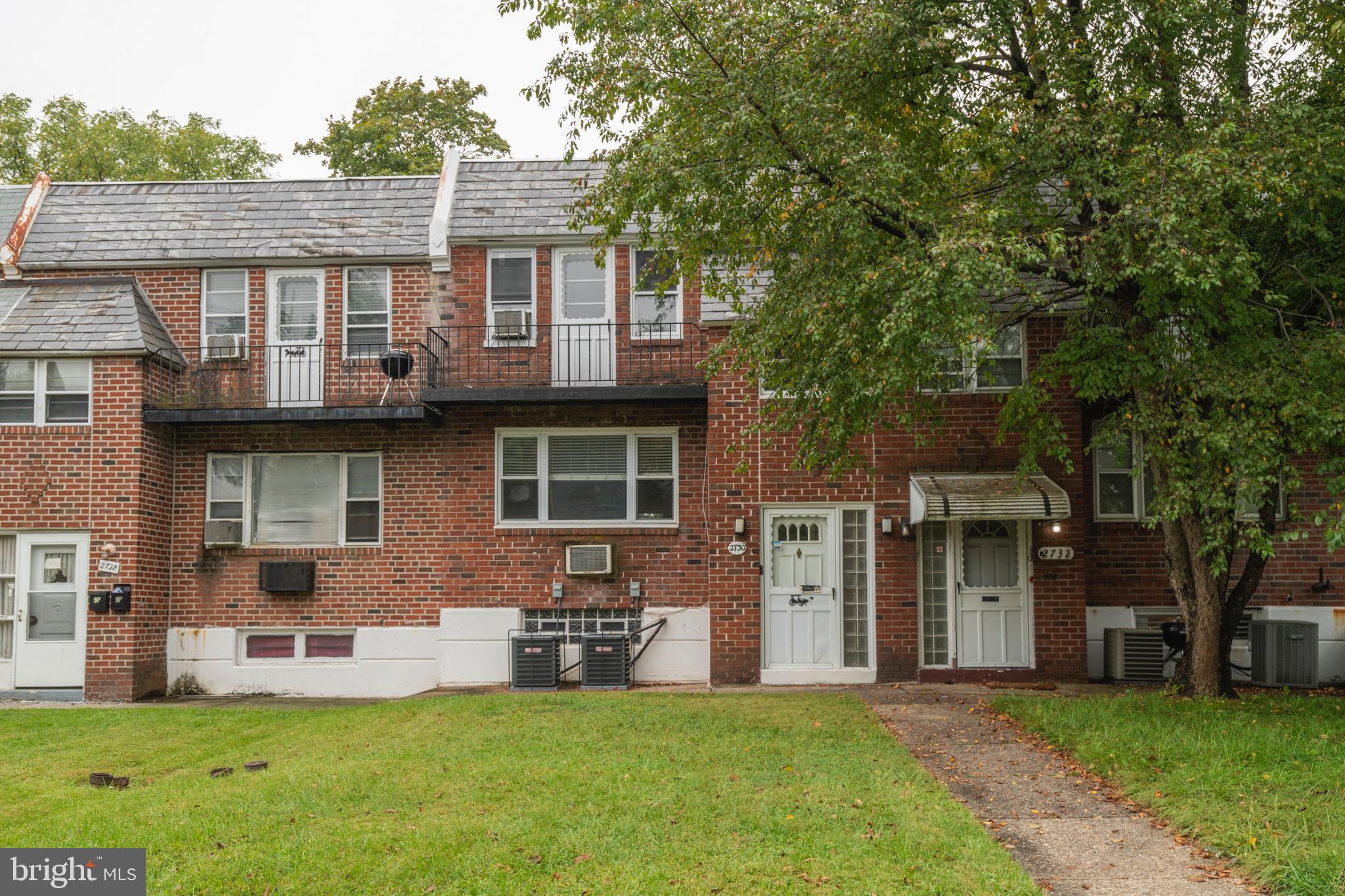 2730 Cranston Road Philadelphia, PA 19131 - Photo 3 of 25 a view of a house with a yard and a tree