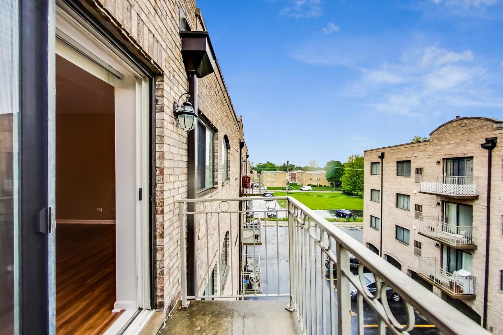 7326 40th Street, Unit 4D Lyons, IL 60534 - Photo 20 of 22 a view of an buildings with a street