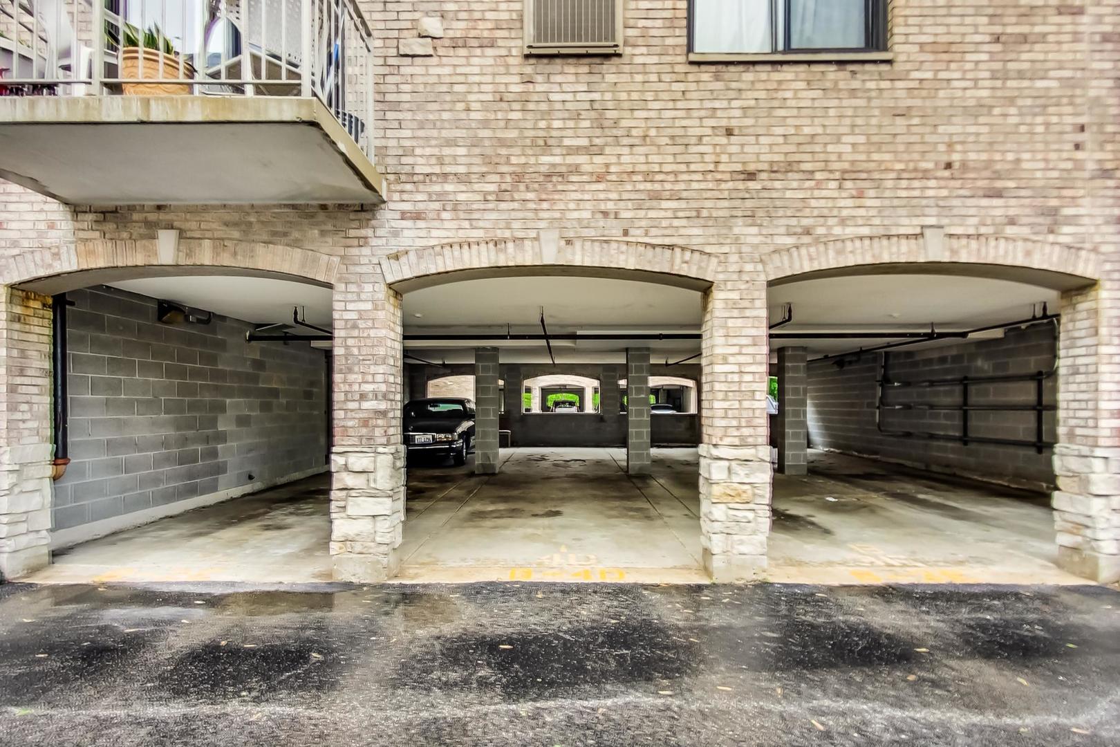 7326 40th Street, Unit 4D Lyons, IL 60534 - Photo 21 of 22 a view of a fireplace and a car parked in the road