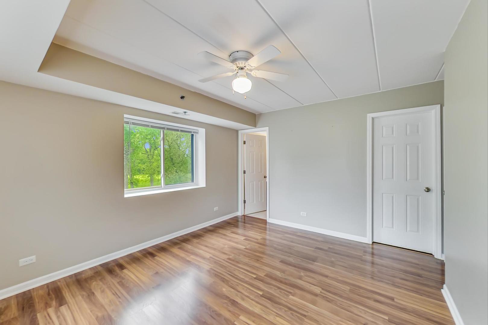 7326 40th Street, Unit 4D Lyons, IL 60534 - Photo 10 of 22 a view of an empty room with a window