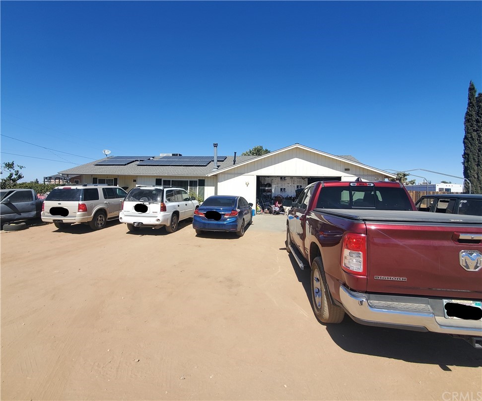6924 Buttemere Road Phelan, CA 92371 - Photo 1 of 1 a car parked in front of a house