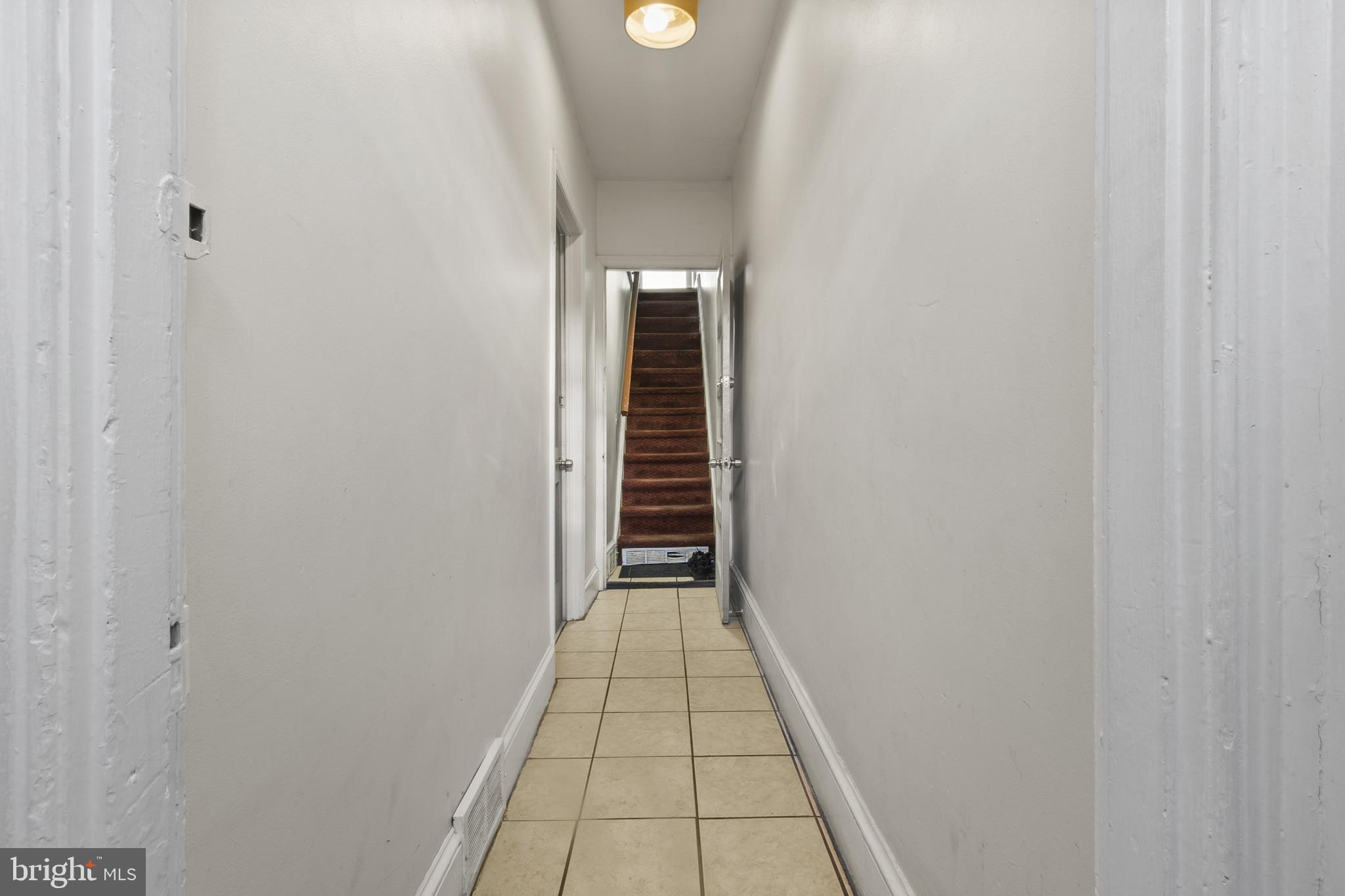 516 Kohn Street Norristown, PA 19401 - Photo 14 of 28 a view of a hallway view with wooden floor and staircase
