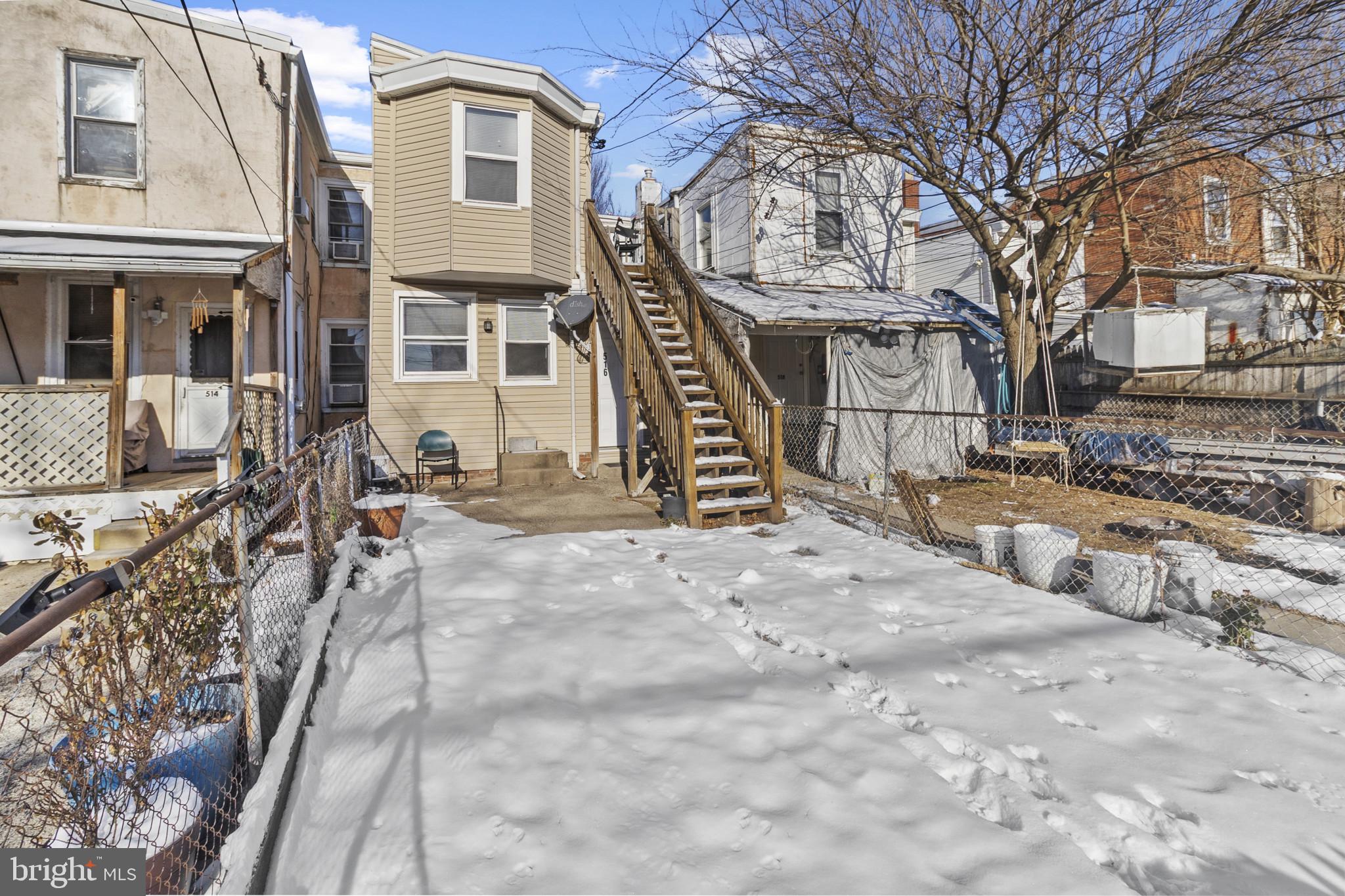 516 Kohn Street Norristown, PA 19401 - Photo 28 of 28 a view of a house with a yard covered in snow