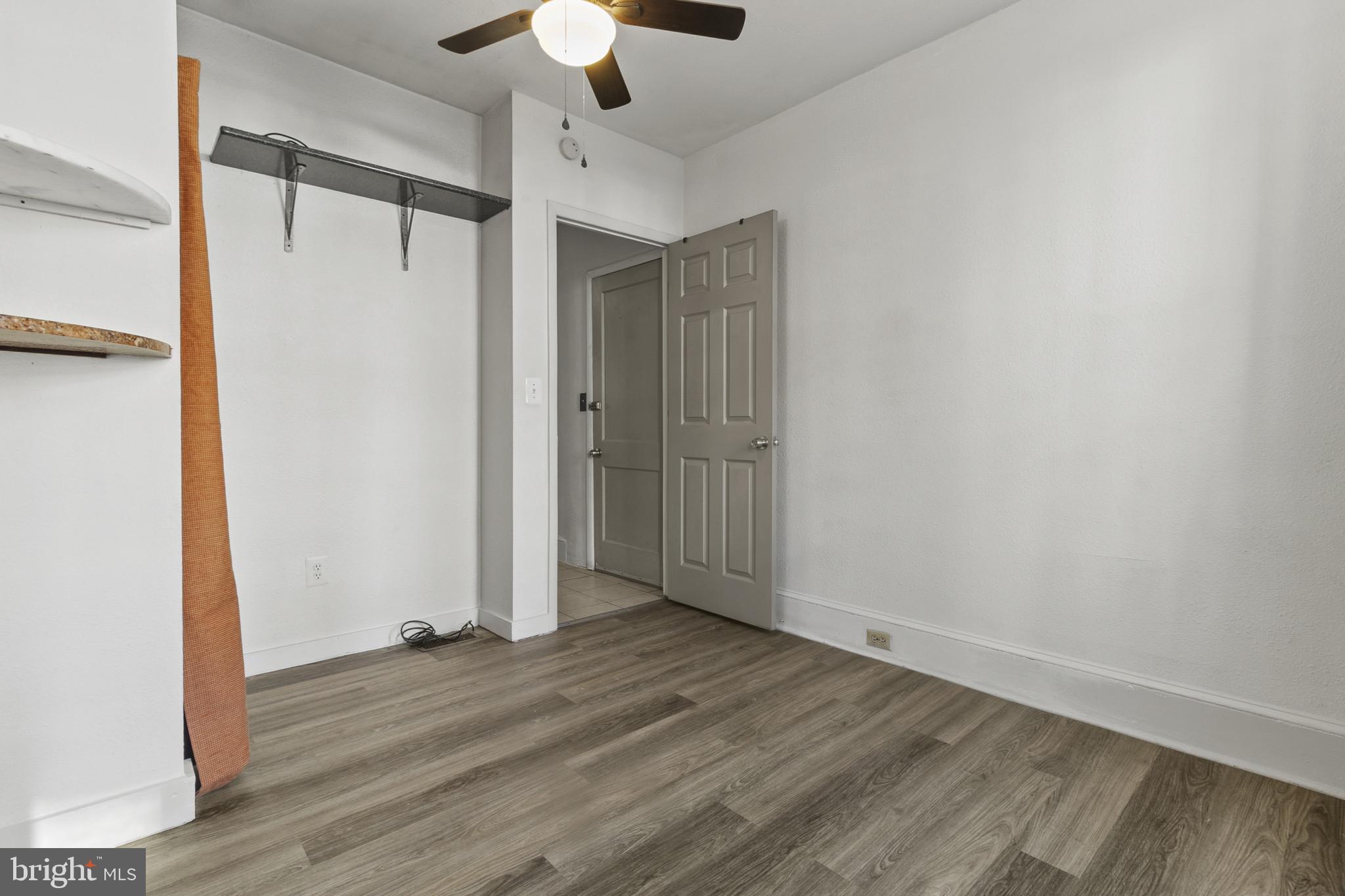 516 Kohn Street Norristown, PA 19401 - Photo 6 of 28 a view of an empty room with wooden floor and a window
