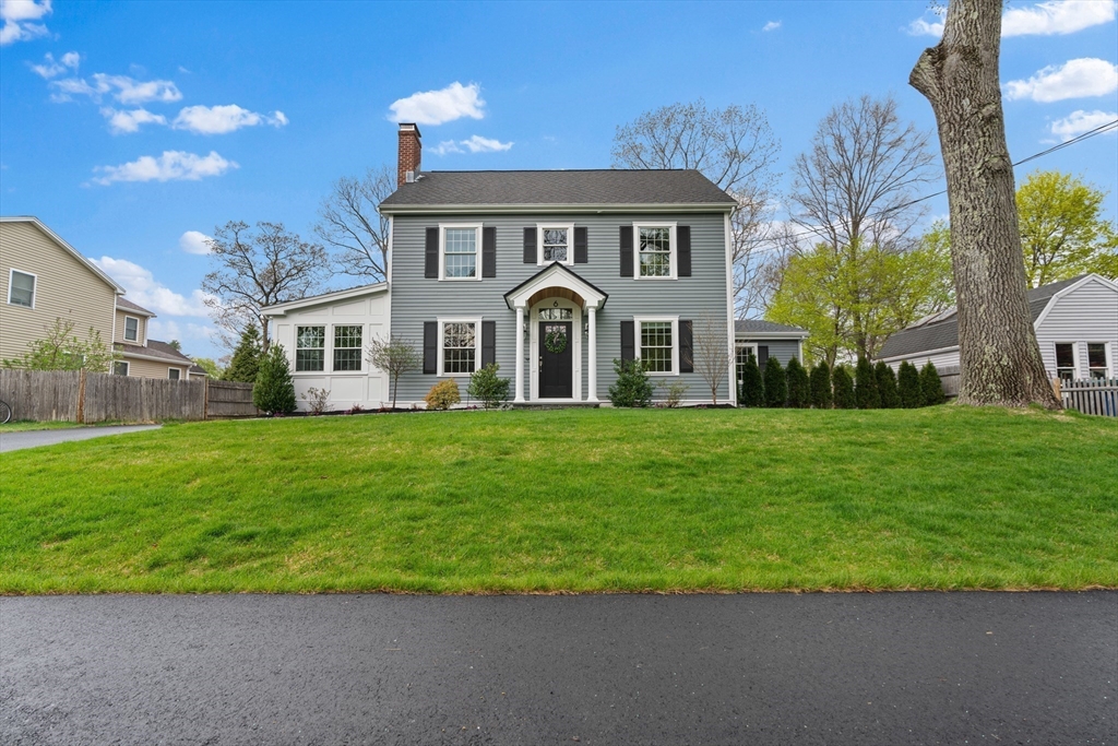 6 Craft Road Natick, MA 01760 - Photo 3 of 42 a front view of a house with a garden