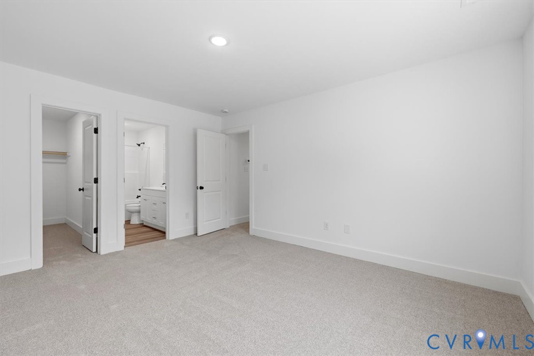 654 Frenchs Store Road Cumberland, VA 23040 - Photo 11 of 24 Spacious room featuring light gray carpeting, whit