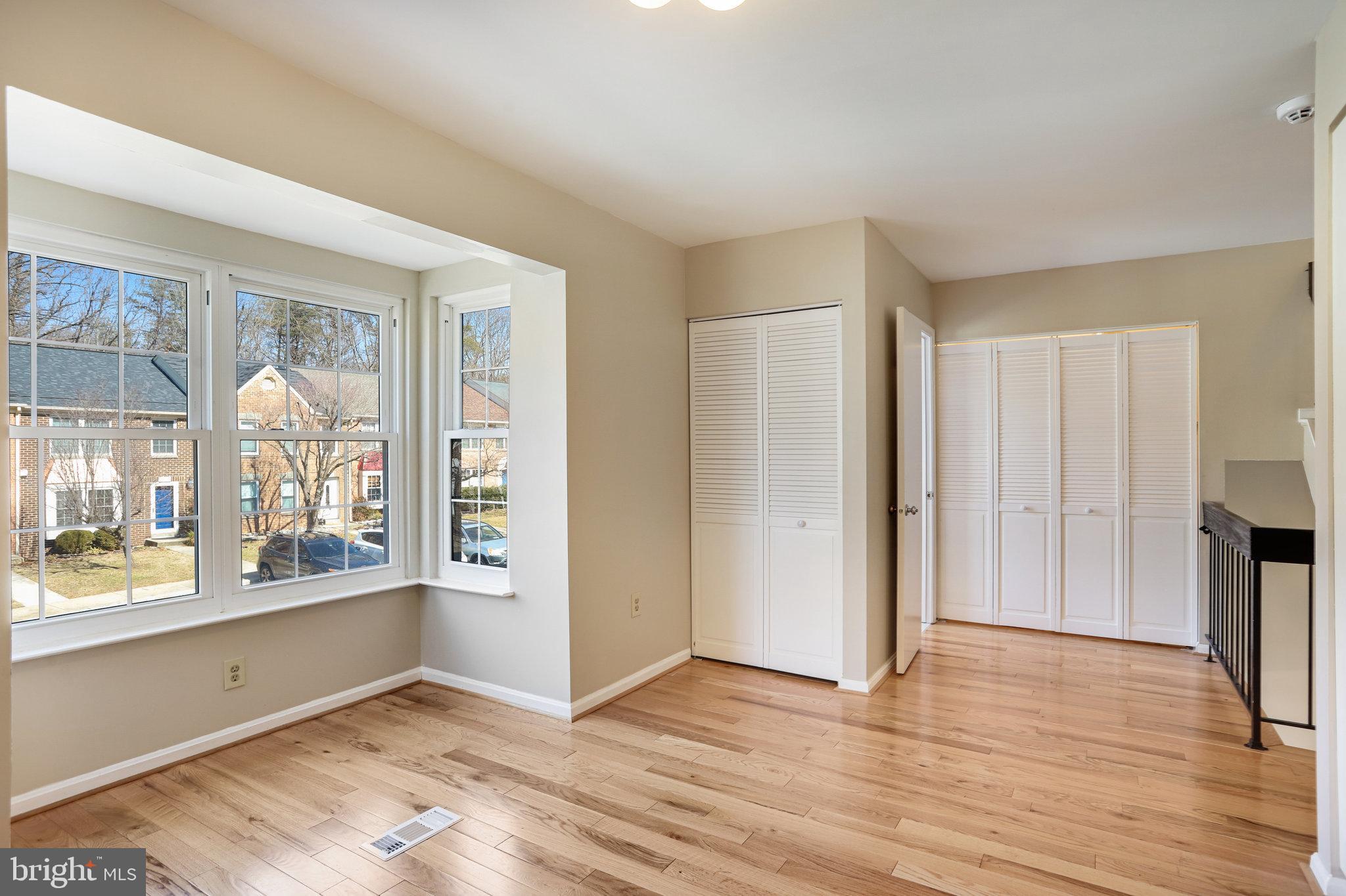 11440 Encore Drive Silver Spring, MD 20901 - Photo 13 of 36 a view of an empty room with wooden floor and a window