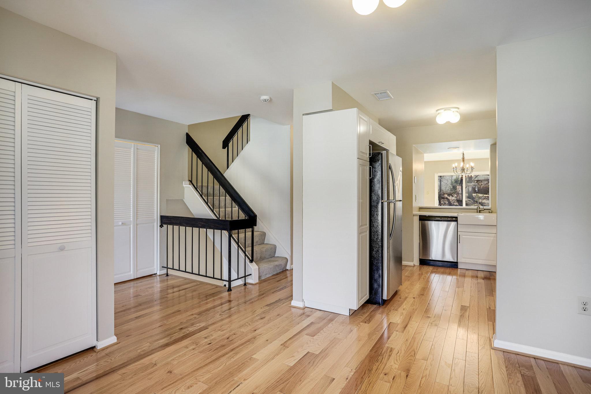 11440 Encore Drive Silver Spring, MD 20901 - Photo 15 of 36 a view of a kitchen with wooden floor electronic appliances and stairs