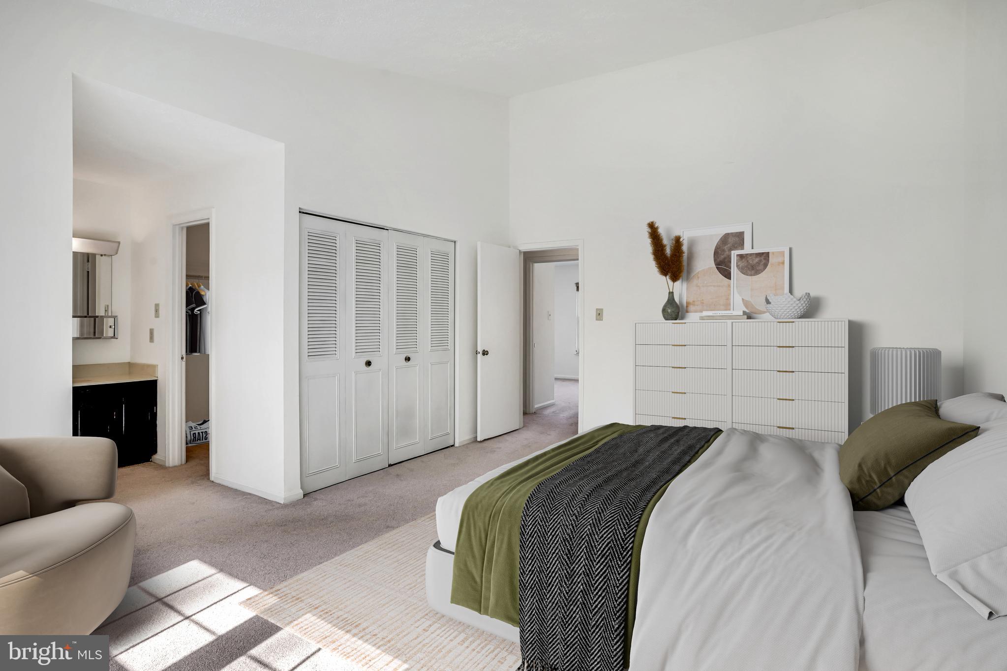 11440 Encore Drive Silver Spring, MD 20901 - Photo 17 of 36 a bedroom with a bed and a couch