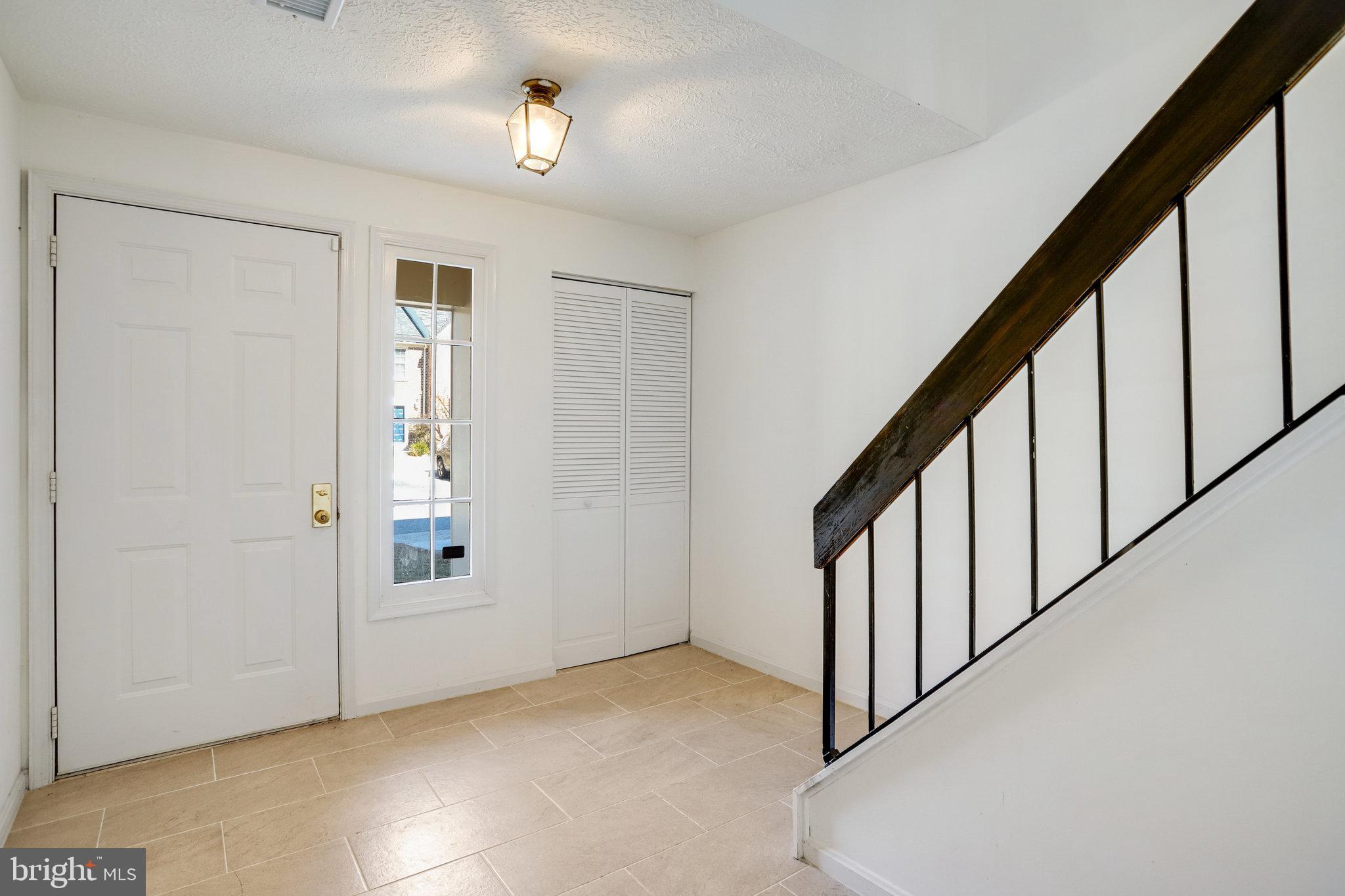 11440 Encore Drive Silver Spring, MD 20901 - Photo 2 of 36 a view of an entryway with wooden floor and stairs